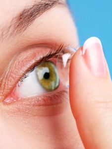 human eye with corrective lens on a blue